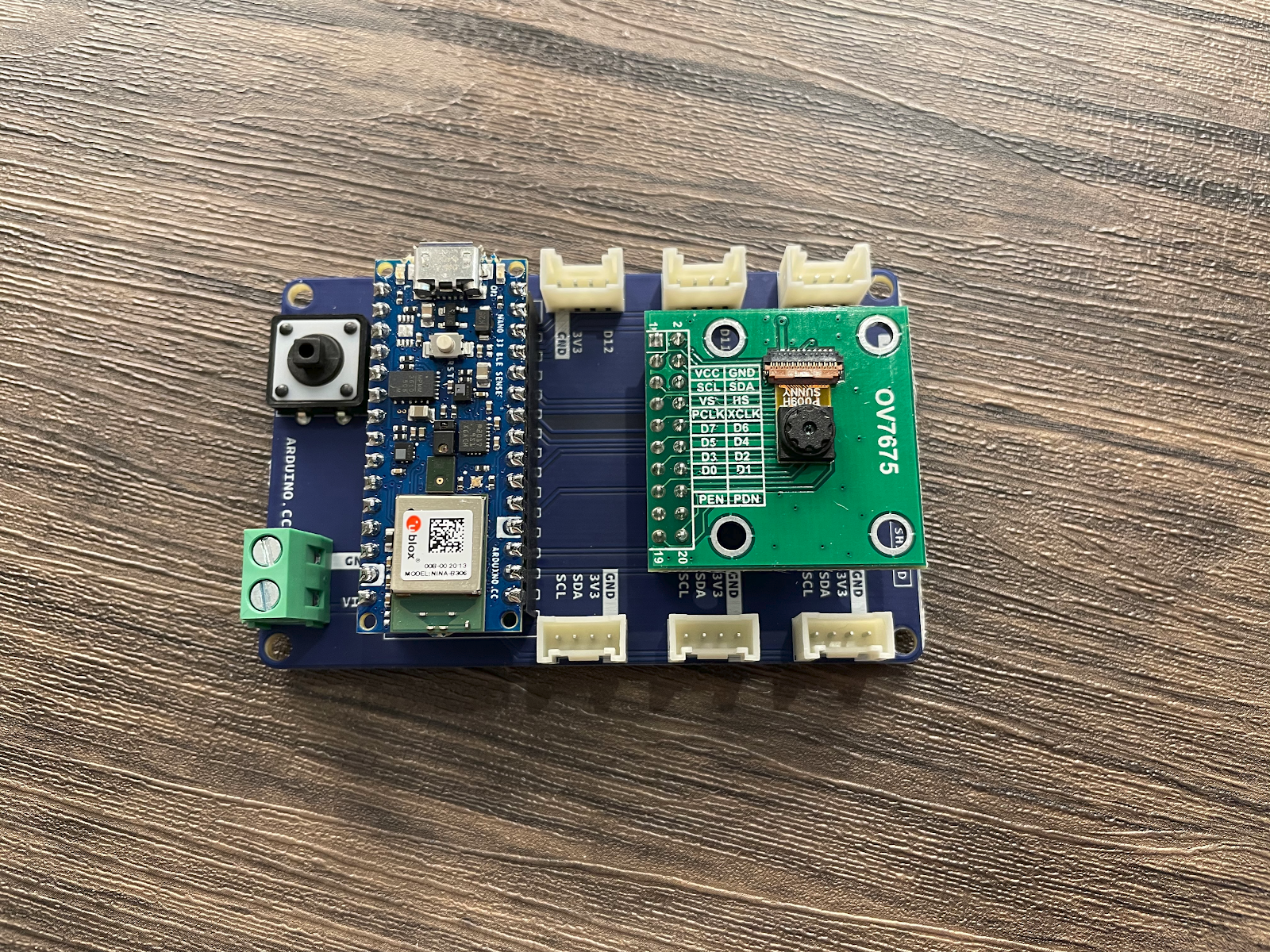 Image of the shield with the Arduino Nano 33 BLE sense in place as well as the Arducam OV7675 slotted into the remaining 2x10 female header.