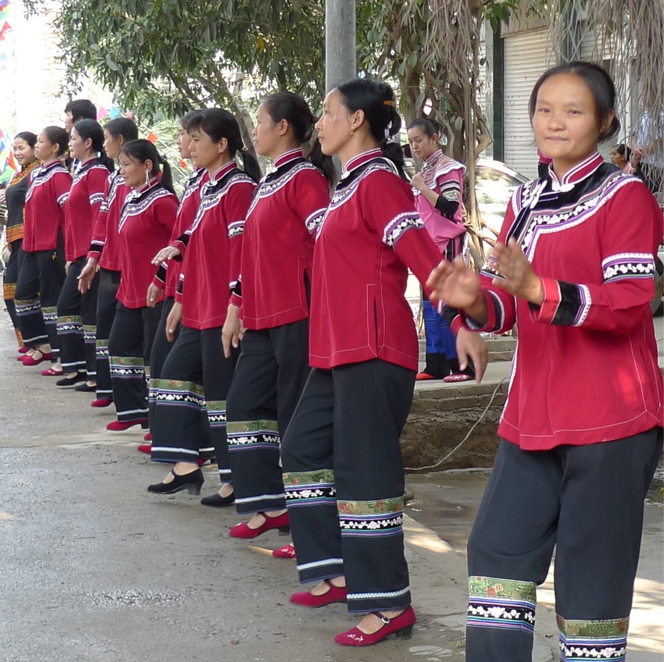 Hani women dancing in a row